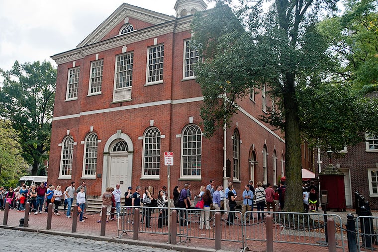 People line up to get into Independence Hall.