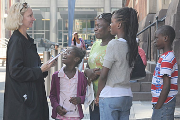 Marsha Cohen, a Homeless Advocacy Project lawyer, speaks with Angela Clay and her children (from left) Alexcia Clay, Tanae Sanders, and Khalil Sanders at the Appletree Family Center. (April Saul / Staff Photographer)