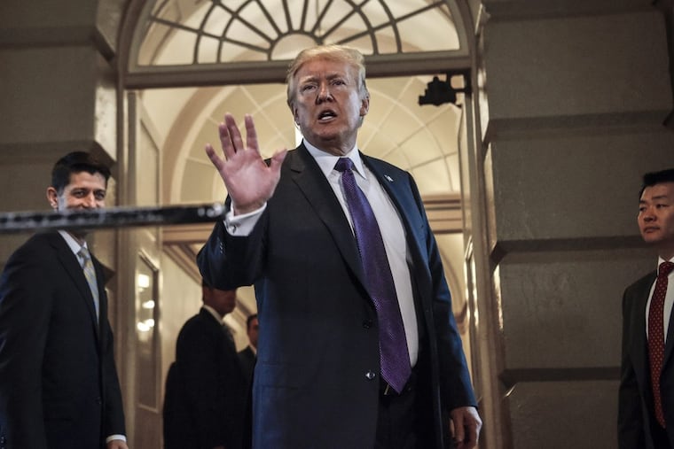President Trump speaks to reporters Thursday as he departs the Capitol after addressing the House Republican Conference in Washington, D.C.
