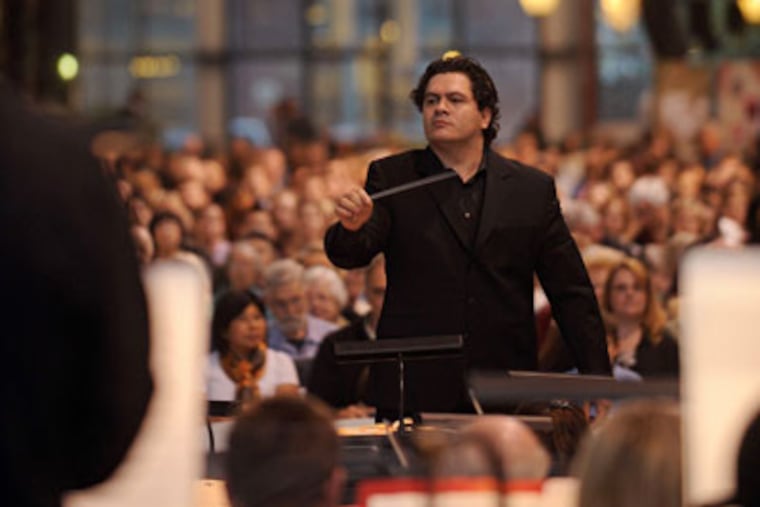Cristian Macelaru conducts the Philadelphia Orchestra in a free Neighborhood Concert at the Navy Yard. About 650 attended — plus a dog that began barking during the “Peer Gynt Suite.” (Robert Williams)