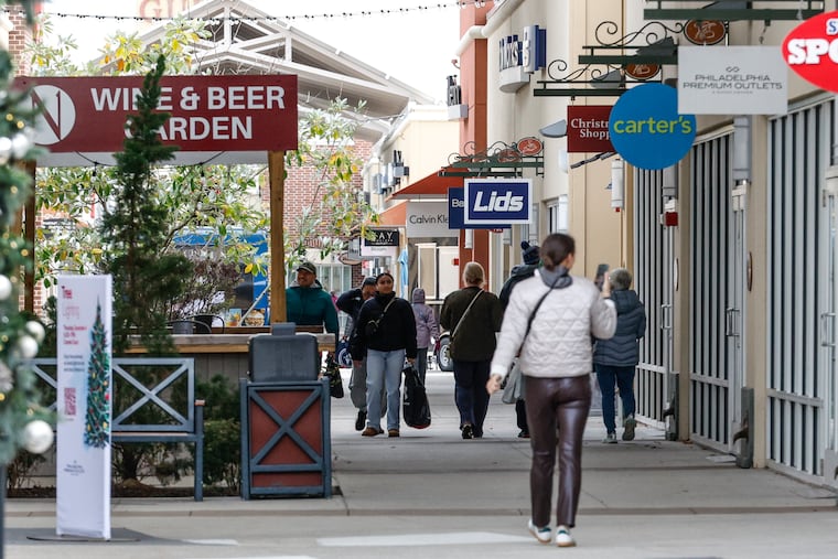 People walk by the new Nissley Vineyards outpost at the Philadelphia Premium Outlets on Nov. 11.