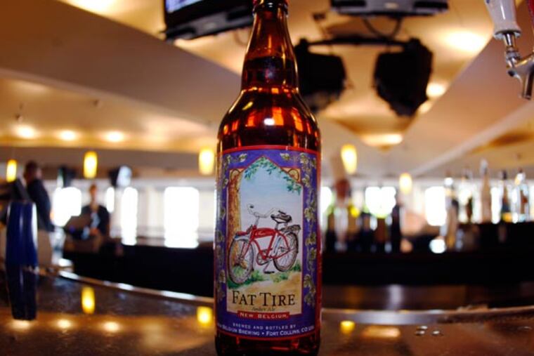 A boittle of Fat Tire Amber Ale sits on the bar in the club level of the Pepsi Center in Denver on Sunday, April 13, 2008.Fat Tire, New Belgium Brewing's flagship brew, is coming soon to Delaware. (AP Photo/David Zalubowski)