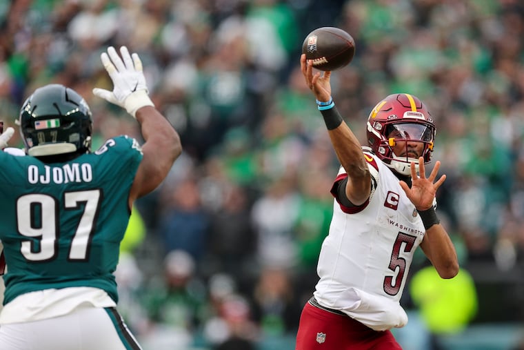 Commanders quarterback Jayden Daniels throws under pressure during the NFC championship game against the Eagles on Jan. 26.