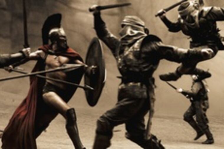Leonidas (Gerard Butler), king of the Spartans, fights his way through the first wave of Persian infantry in "300," the story of the 480 B.C. Battle of Thermopylae, in which 300 Spartans fought a relentless horde of Persian invaders. It's buff and bloody, but the dialogue and acting are weaklings.