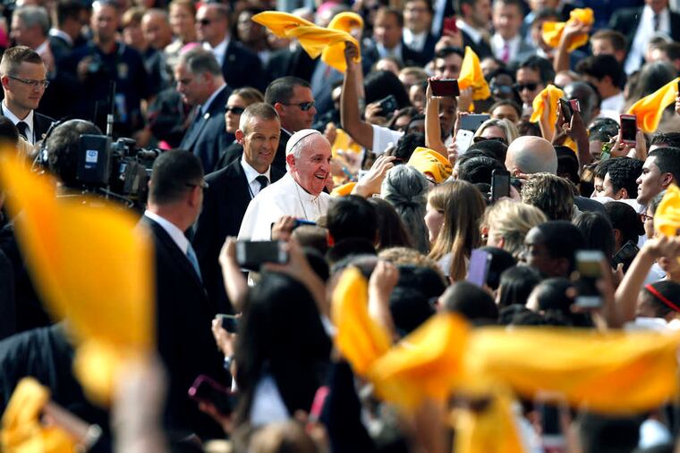Pope Francis is welcomed at Our Lady Queen of Angels School, set amid public housing in the heavily Hispanic neighborhood of East Harlem.