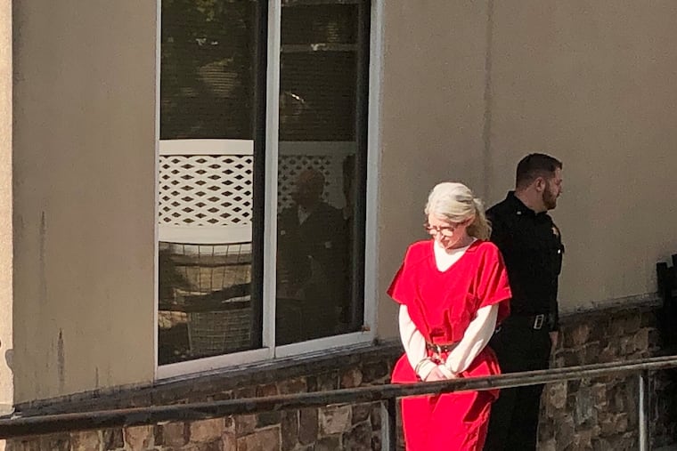 Beth Peterson, seen leaving a magisterial district courthouse in Aston, has been charged with first- and third-degree murder in the death of her boyfriend, Matthew Wilcox.