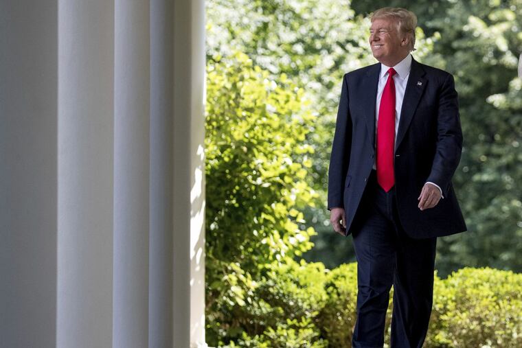 President Trump arrives in the Rose Garden to announce Thursday that the United States is pulling out of the Paris climate change accord.