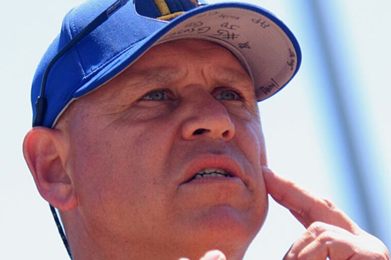 Buena coach Harry Grose signals to his pitcher during a game last spring. (Lou Rabito/Staff)