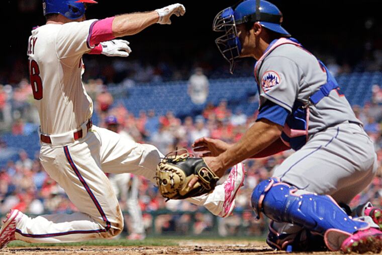 Chase Utley slides past Mets catcher Anthony Recker. (Yong Kim/Staff Photographer)