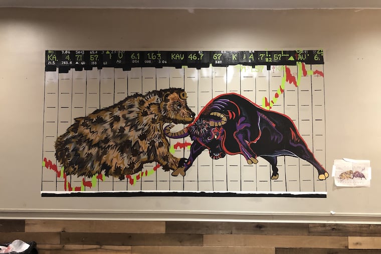 A bull and bear-theme mural, reflecting the owners' background in finance, is a work in progress at the new location of Swiss Haus, 1740 Sansom St.