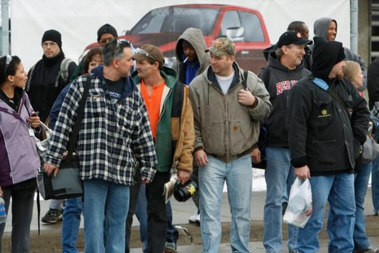 The United Auto Workers says pay and benefit concessions in the bailout plan are an attempt to break the union and its members, such as these in Warren, Mich.