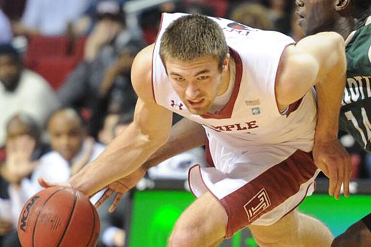 Temple's Dalton Pepper drives around Charlotte's Terrance Williams and
goes in for a layup during second half action Feb. 6, 2013 at Temple. (Clem Murray/Staff Photographer)