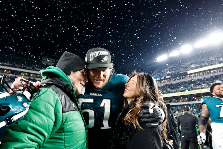 Eagles center Cam Jurgens greets his family after the NFC championship game at Lincoln Financial Field on Sunday.