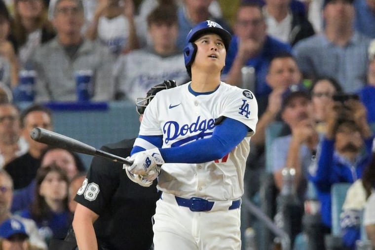 Shohei Ohtani watches his second home run in Game 4 of the NLCS. He finished with three in the 5-1 win over the Brewers.