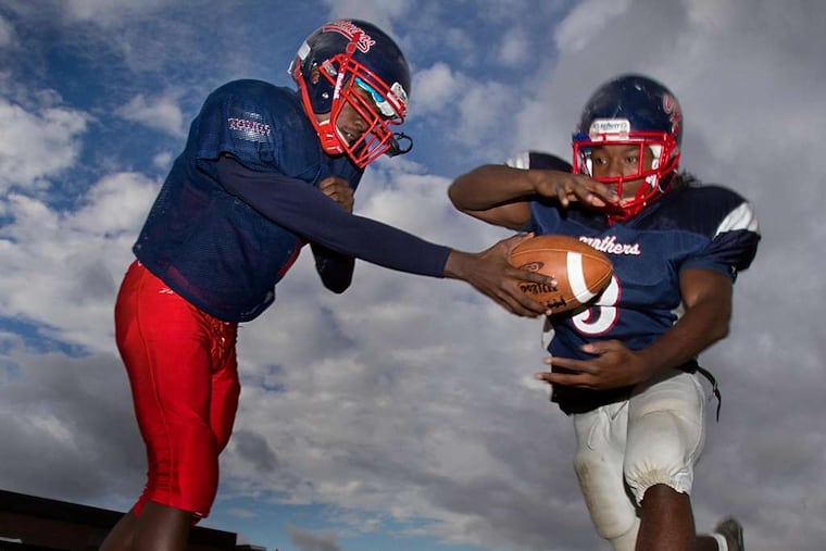 Robert Cleveland takes a handoff from Willingboro quarterback Anthony Robbins. The Chimeras are the No. 3 seed in the South Jersey Group 2 football playoffs. DAVID M WARREN / Staff Photographer
