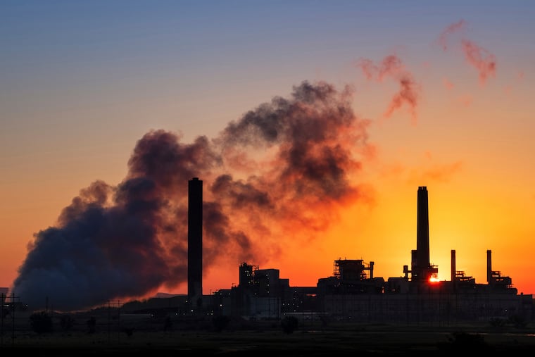 FILE - A coal-fired power plant. (AP Photo/J. David Ake, File)