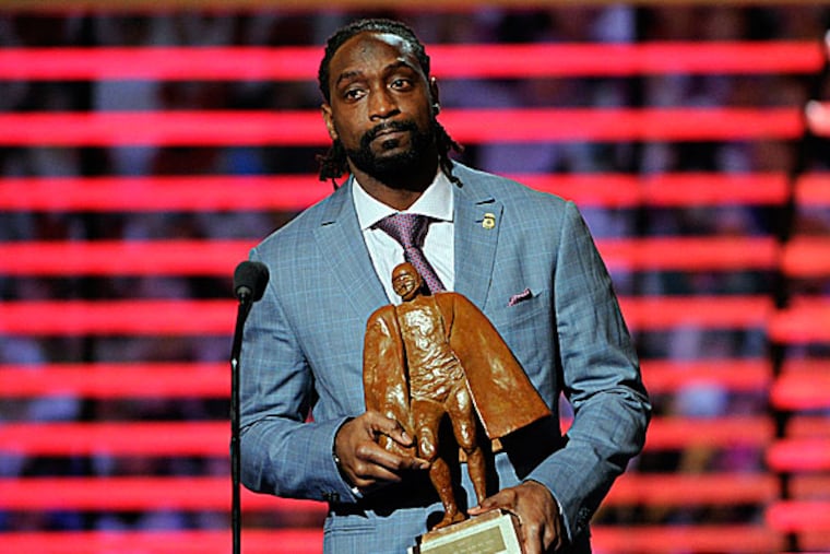 The Bears' Charles Tillman accepts the award for Walter Payton NFL Man of the Year. (Evan Agostini/Invision for NFL/AP Images)