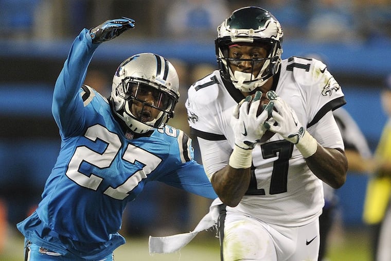 Philadelphia Eagles’ Alshon Jeffery (17) catches a pass in front of Carolina Panthers’ Kevon Seymour (27) in the second half of an NFL football game in Charlotte, N.C., Thursday, Oct. 12, 2017.