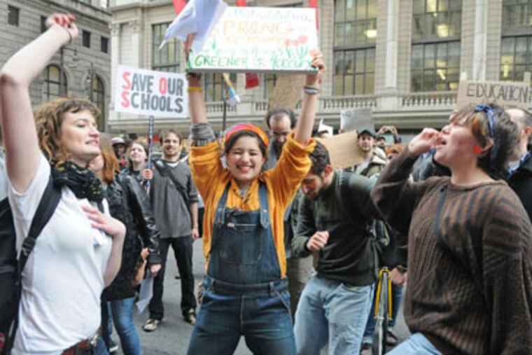 Students (from left) Brianne Murphy of Temple University, Samantha Shain of Haverford College and Johannah Cordonhill of Bryn Mawr College demonstrate. (Sarah Glover / Staff Photographer)