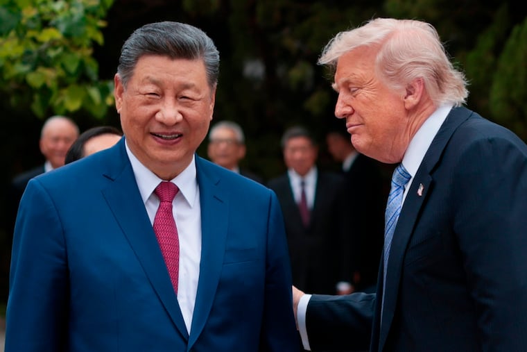 U.S. President Donald Trump, right, speaks with Chinese President Xi Jinping while leaving after a visit to the Zhongnanhai Garden in Beijing, Friday, May 15, 2026.