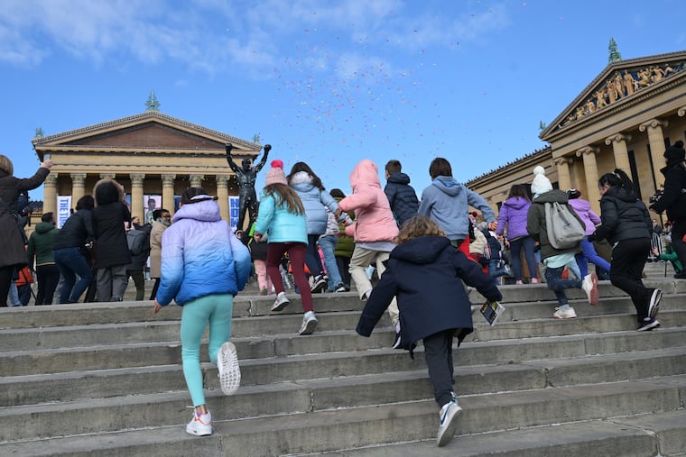 A group of one hundred and twenty five students from a combine of elementary schools run the Rocky Steps on Tuesday, Dec. 3, 2024 during an unveiling to Kick Off First-Ever Rocky Festival at the Philadelphia Museum of Art in Philadelphia, Pa. Sylvester Stallone lends his Rocky statue to the city for Rocky Fest and it will be placed on top of the steps of the Philadelphia Museum of Art, where it was in Rocky III, for a month.