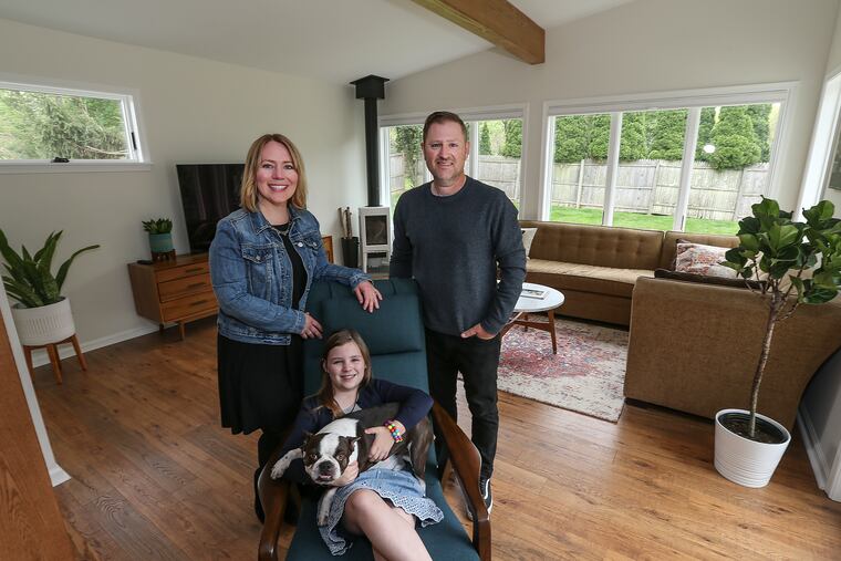 Jennifer and Joe Coe, with their 9-year-old daughter, Jaelyn, and Kona the dog, are happy with the expansion of their home in Whitpain Township.