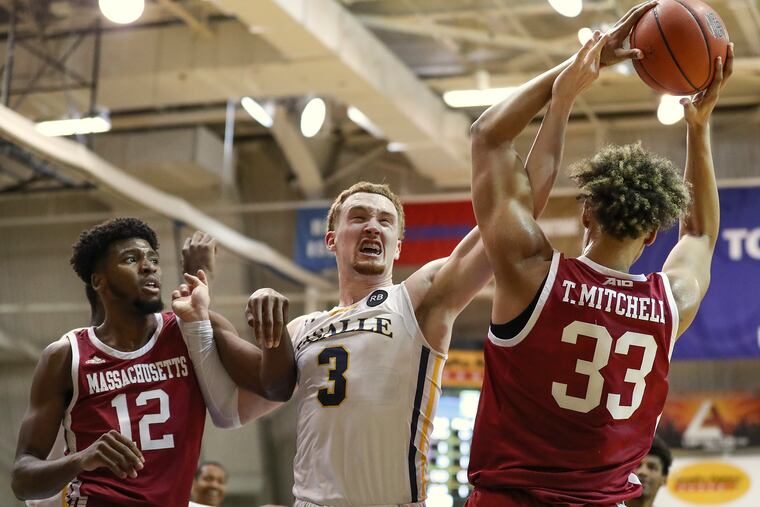 UMass' Tre Mitchell (33) in a game last season against La Salle.