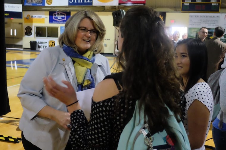LaSalle University president Colleen Hanycz greets juniors Marissa Beaver, center, and Emily Paynter, right in September.