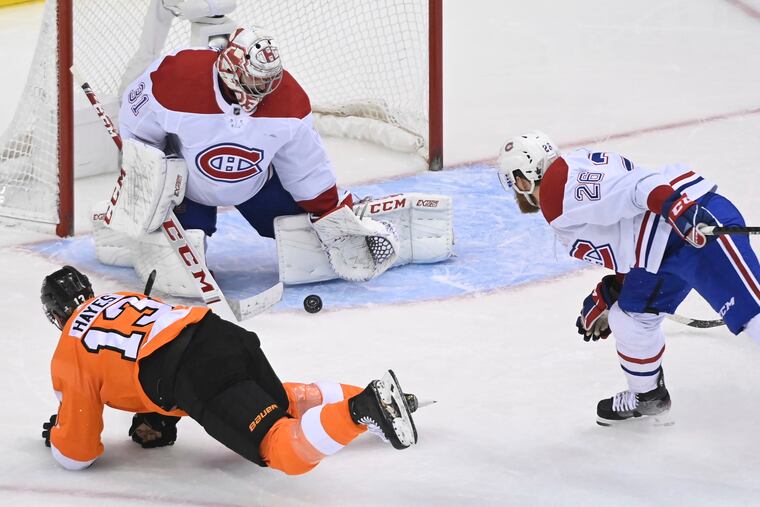 The Flyers' Kevin Hayes, left, watches as Montreal Canadiens goalie Carey Price makes a save during the third period.