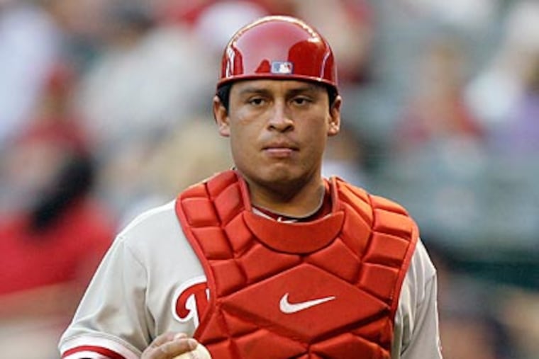 Carlos Ruiz's knee injury is not expected to send the Phillies' top catcher to the disabled list. (AP Photo/Paul Connors)