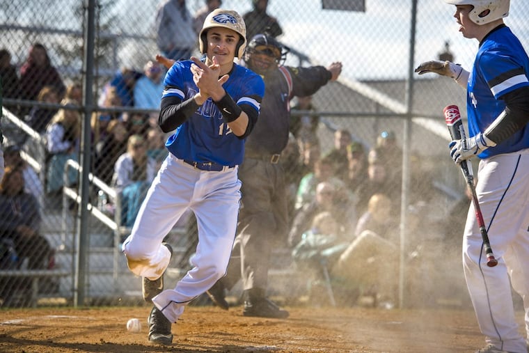 Paul VI senior John Urbach jumps up after stealing home Thursday vs. Audubon.