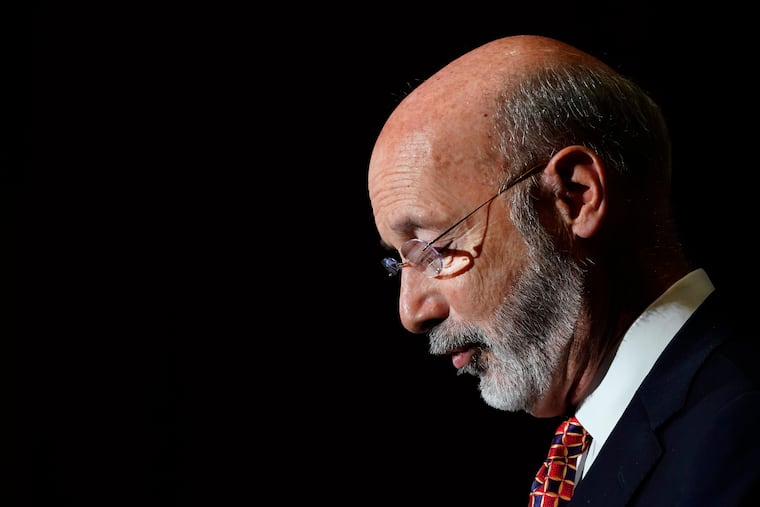 Pennsylvania Gov. Tom Wolf looks down while speaking during a rally to raise the state minimum wage at Sharon Baptist Church, Friday, July 9, 2021, in Philadelphia.