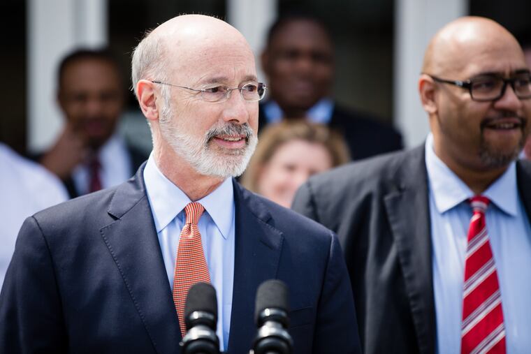 Gov. Tom Wolf (left) signed an order that directed the Department of Corrections, led by Secretary John Wetzel (right), to create a reprieve program for medically vulnerable inmates convicted of nonviolent crimes.