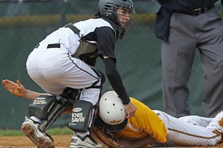 Neuman-Goretti's Nicky Nardini tags out Archbishop Wood's Sean Sheridan in the first inning. (Michael Bryant/Staff Photographer)