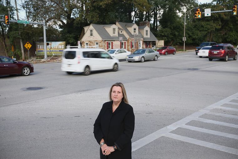 Pattye Benson, president of the Tredyffrin Historic Preservation Trust, stands for a portrait at the intersection of Routes 30 and 252 in Paoli, Pa., on Wednesday, Oct. 17, 2018.