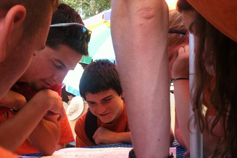 A co-ed crew from Troop 33, IHM Catholic Church, Wilmington, part of Delmarva Council BSA, plans its trek at Philmont Scout Ranch, Cimarron, New Mexico, in June 2013.