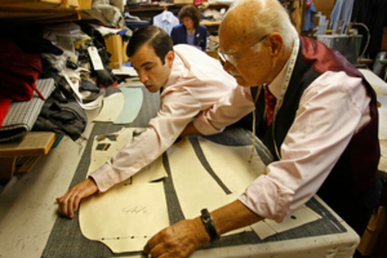 Apprentice and master: Joseph Genuardi, 27, marks a pattern with Joseph Centofanti, 89. Centofanti's daughter, Helen, is in the background.