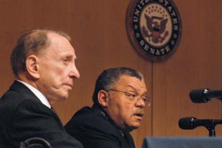 Philadelphia Police Commissioner Charles H. Ramsey, right, testifies today as U.S. Sen. Arlen Specter, left, convenes a Senate subcommittee hearing on witness intimidation at the Constitution Center. (Tom Gralish / Staff Photographer)