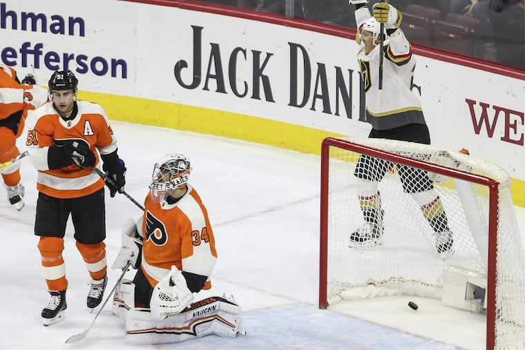The Golden Knights’ Cody Eakin celebrates after Ryan Carpenter scored the deciding goal late in the third period against the Flyers Monday night.