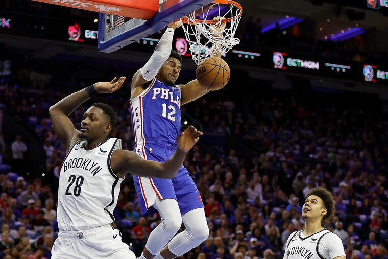 Sixers forward Tobias Harris dunks over Brooklyn Nets forward Dorian Finney-Smith in Game 2 of their first-round NBA playoffs series.