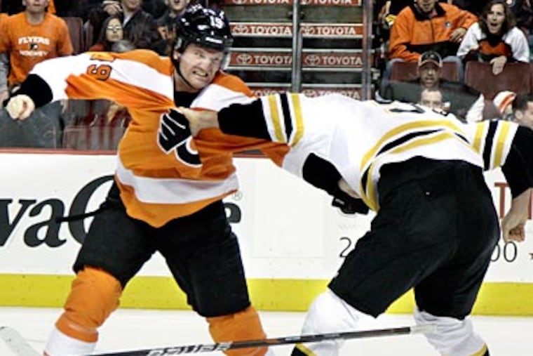 Scott Hartnell and Johnny Boychuk fight during the Flyers' 6-0 loss to the Bruins. (Elizabeth Robertson/Staff Photographer)