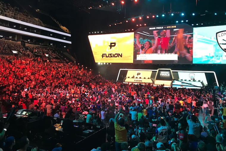 Fans of the e-sports Overwatch League watch as the Philadelphia Fusion competed against the London Spitfire in the Overwatch League Grand Finals at the Barclays Center in New York City, N.Y. on Saturday, July 28, 2018. (Courtney Becker/Philadelphia Inquirer/TNS)