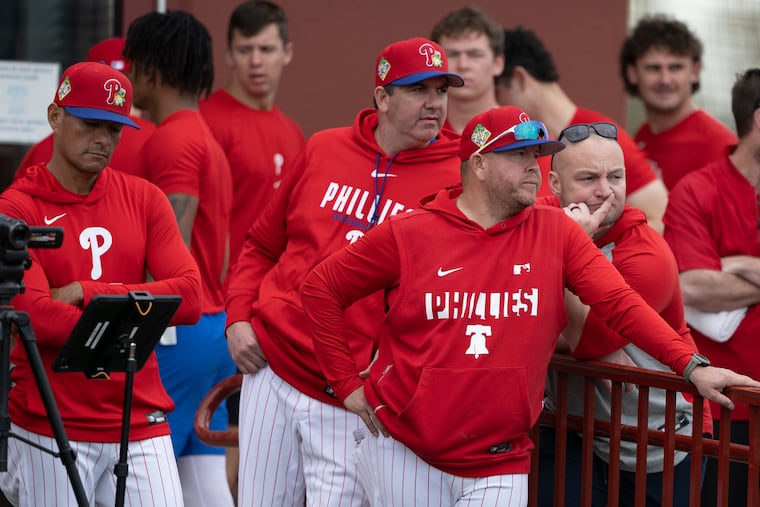 Phillies coaches oversee pitching workouts Wednesday at BayCare Ballpark in Clearwater, Fla.