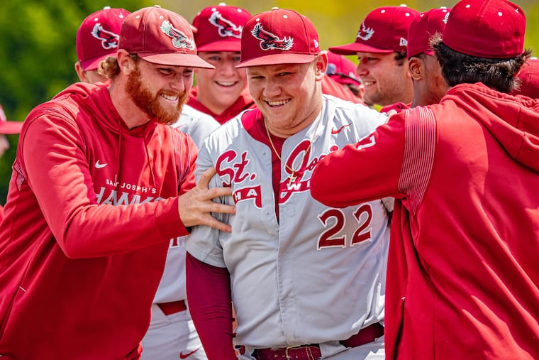 St. Joseph's pitcher Ian McCole is congratulated by teammates after throwing a no-hitter at St. Bonaventure.