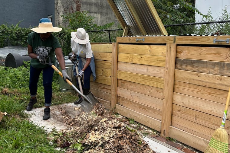 Volunteers composting at the Mantua Urban Peace Garden in Philadelphia.