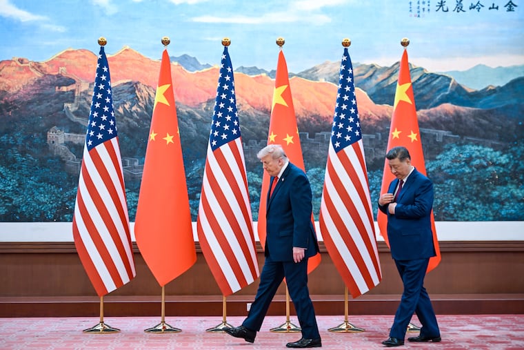 Chinese President Xi Jinping, right, and U.S. President Donald Trump meet at the Great Hall of the People in Beijing, Thursday, May 14, 2026.