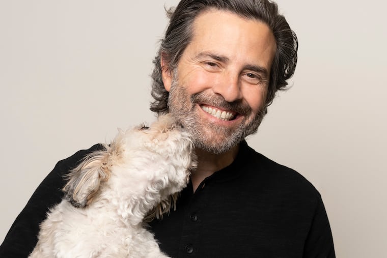Paul Guyardo, new CEO of dog and cat insurer Petplan, with his shichon, Honcho
