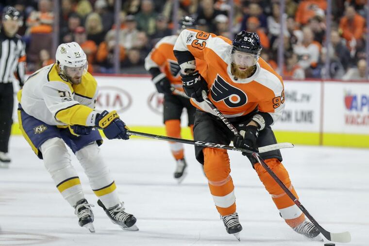 Flyers right wing Jakub Voracek skates with the puck past Nashville Predators left wing Austin Watson during the second period on Thursday.