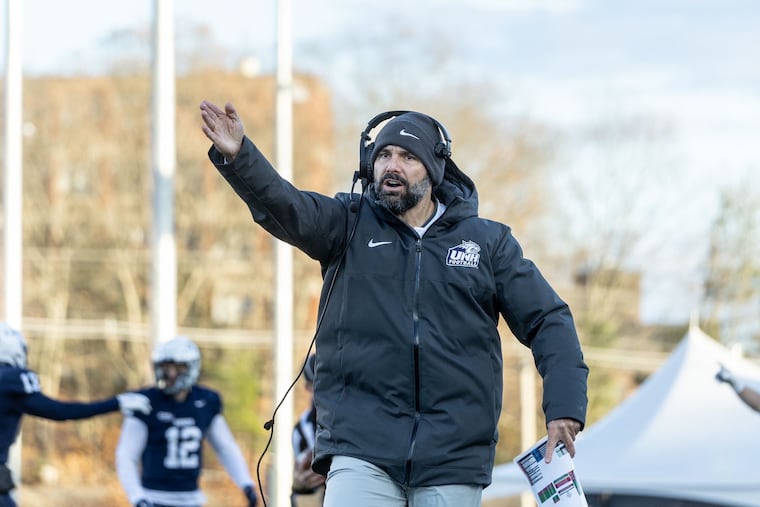 Penn has hired former New Hampshire coach Rick Santos as the next leader of the Quakers.