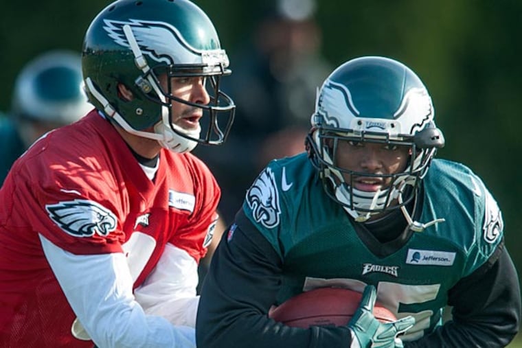 Eagles quarterback Mark Sanchez hands off to running back LeSean McCoy. (Clem Murray/Staff Photographer)
